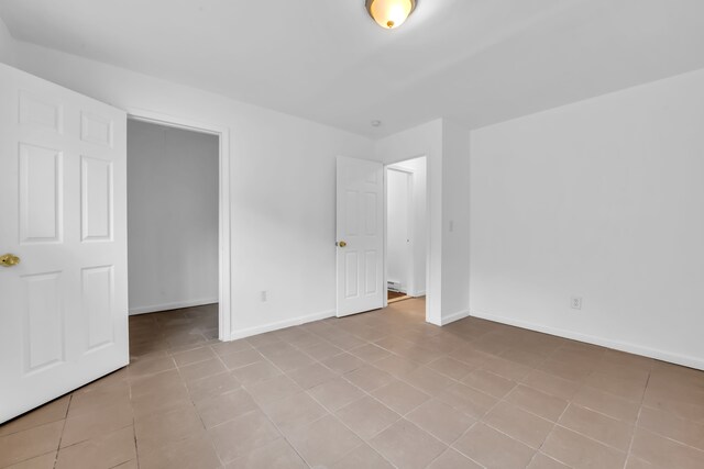 10420 Whittier St, Detroit, MI 48224 - empty room featuring baseboards and tile patterned flooring