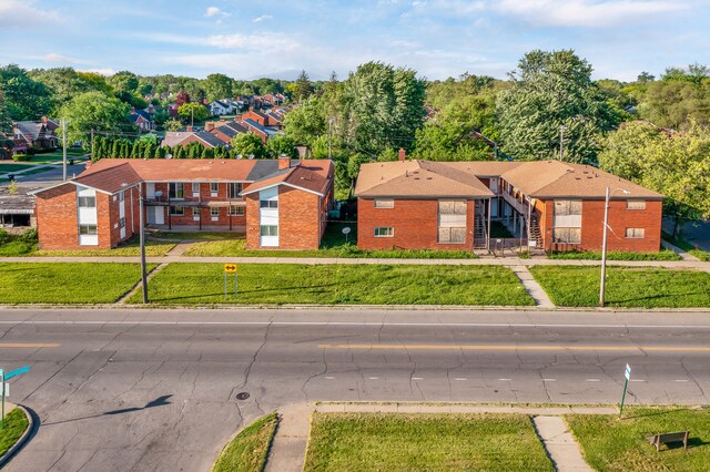 10420 Whittier St, Detroit, MI 48224 - view of front facade featuring brick siding and a front yard