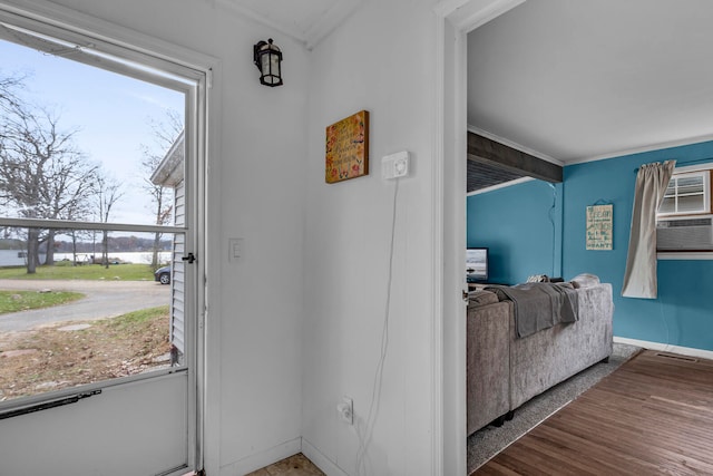 entryway with hardwood / wood-style flooring