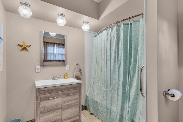 bathroom featuring tile patterned flooring, vanity, and shower / bath combo