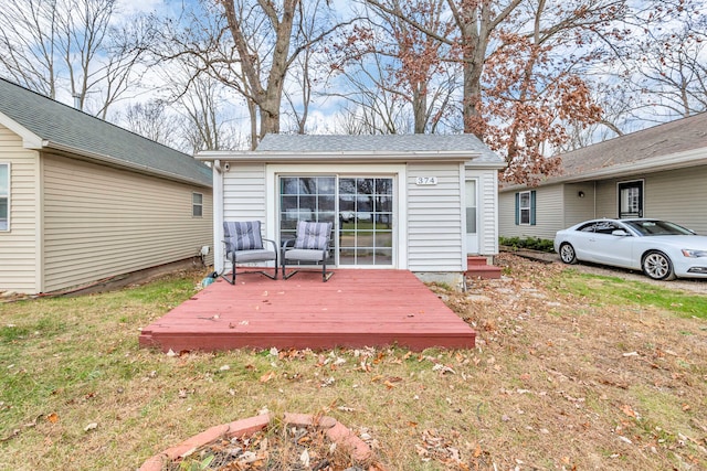 wooden deck with a yard