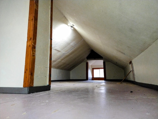 additional living space with lofted ceiling