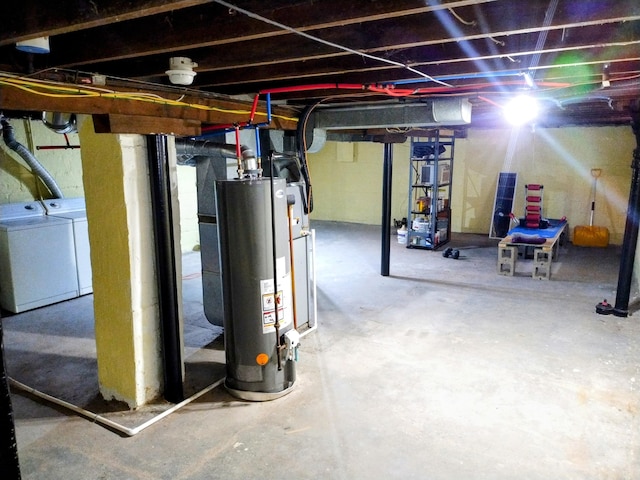 basement featuring separate washer and dryer and water heater