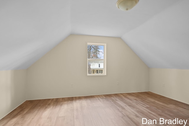 bonus room featuring light hardwood / wood-style floors and vaulted ceiling