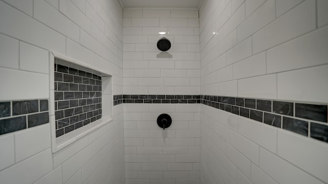 full bath with a tile shower