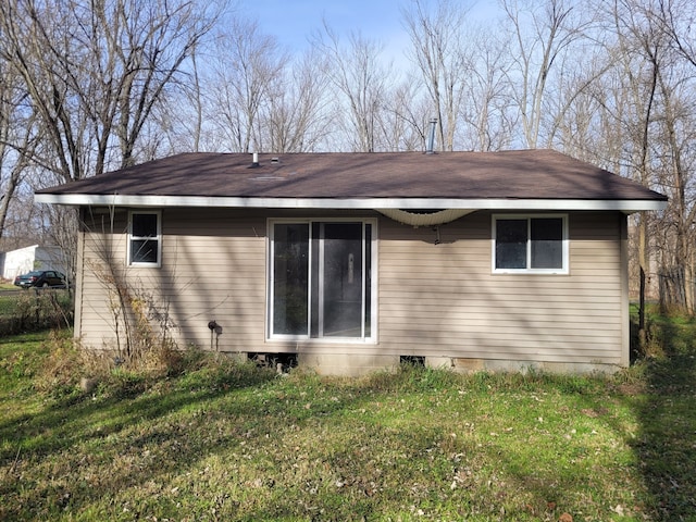 view of home's exterior with a yard