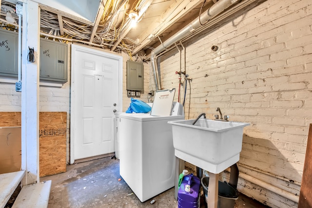 laundry area with separate washer and dryer and electric panel