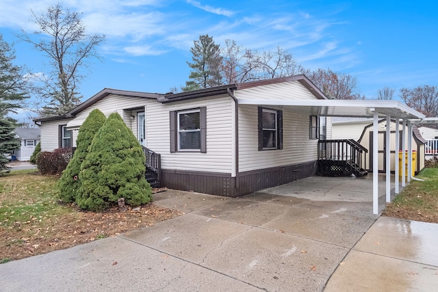 view of side of property featuring a carport