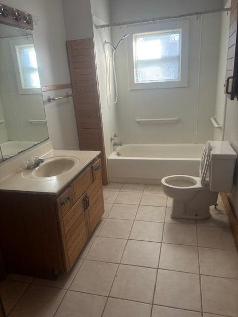 231 W Todd Ave, Reed City, MI 49677 - full bathroom featuring toilet, shower / tub combination, tile patterned flooring, and vanity