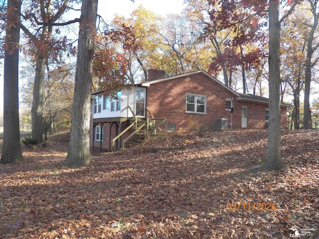 exterior space featuring central air condition unit