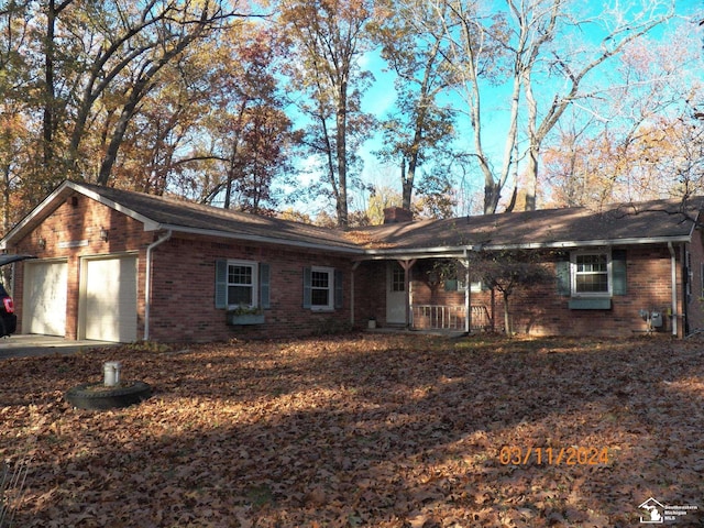 view of front of home featuring a porch and a garage