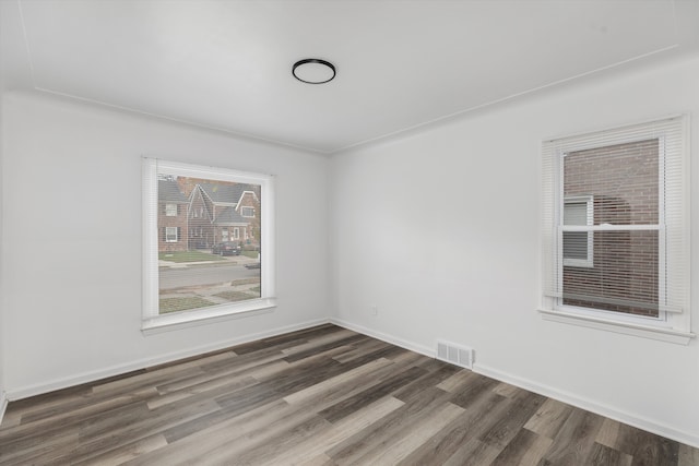 unfurnished room featuring dark hardwood / wood-style floors