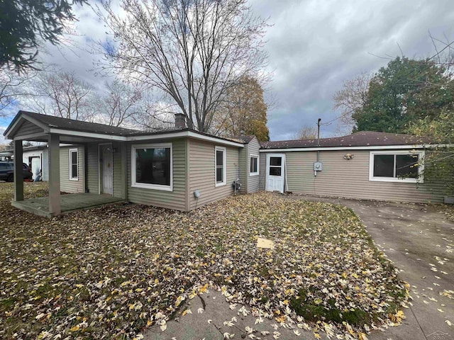 back of property with a patio