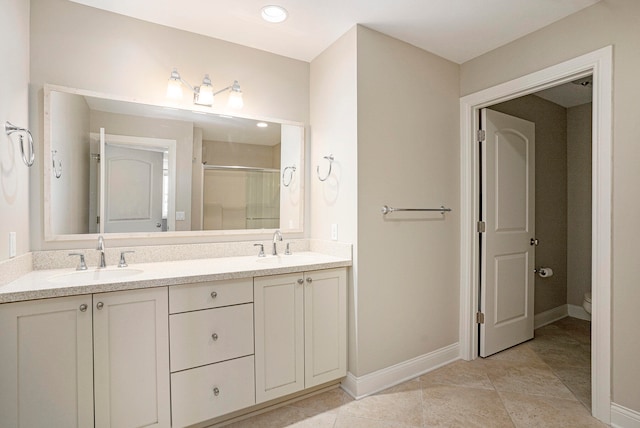 bathroom with toilet, vanity, tile patterned floors, and an enclosed shower