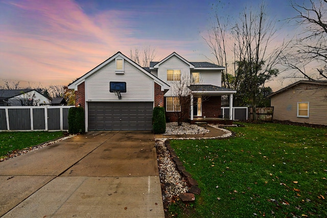 view of property featuring a porch, a garage, and a yard