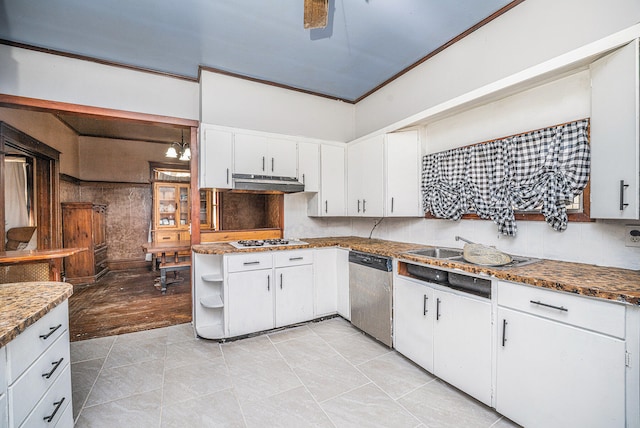 kitchen with white cabinetry, dishwasher, dark stone countertops, light wood-type flooring, and ornamental molding