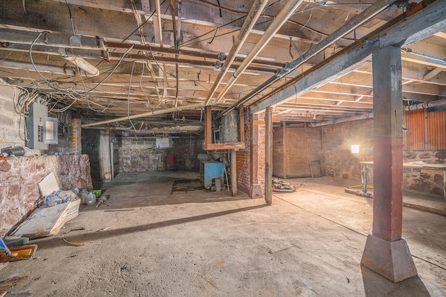 basement featuring electric panel