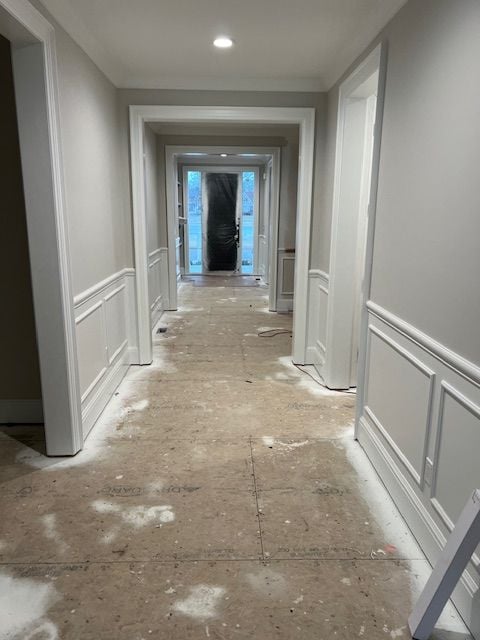 hallway featuring crown molding