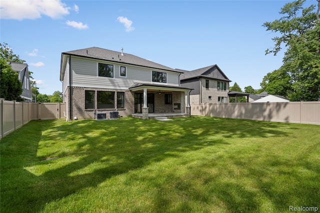 2182 Buckingham Ave, Birmingham, MI 48009 - rear view of property featuring brick siding, cooling unit, a gate, and a patio