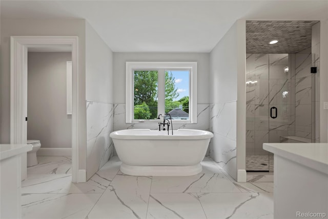 2182 Buckingham Ave, Birmingham, MI 48009 - bathroom featuring a soaking tub, a marble finish shower, marble finish floors, toilet, and a wainscoted wall