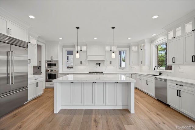 2182 Buckingham Ave, Birmingham, MI 48009 - kitchen featuring stainless steel appliances, a sink, tasteful backsplash, white cabinets, and recessed lighting