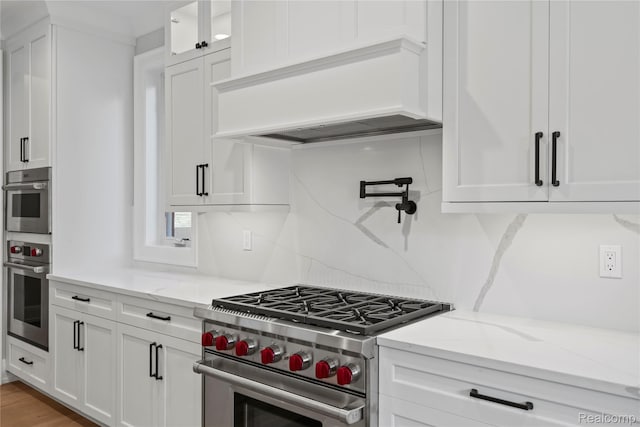 2182 Buckingham Ave, Birmingham, MI 48009 - kitchen featuring stainless steel appliances, custom exhaust hood, and white cabinetry