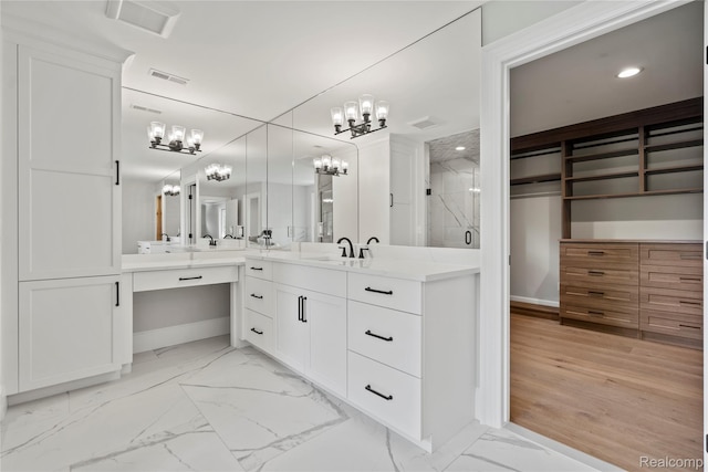 2182 Buckingham Ave, Birmingham, MI 48009 - full bathroom with a chandelier, vanity, a marble finish shower, baseboards, and recessed lighting