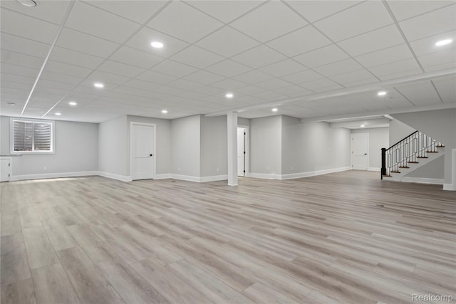 2182 Buckingham Ave, Birmingham, MI 48009 - finished below grade area featuring stairway, baseboards, light wood-style floors, and recessed lighting