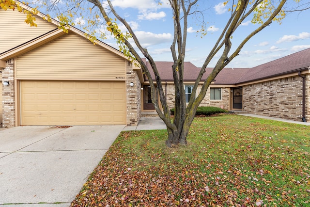 view of front of house with a garage and a front lawn