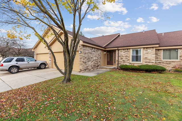 view of front of house featuring a front yard and a garage