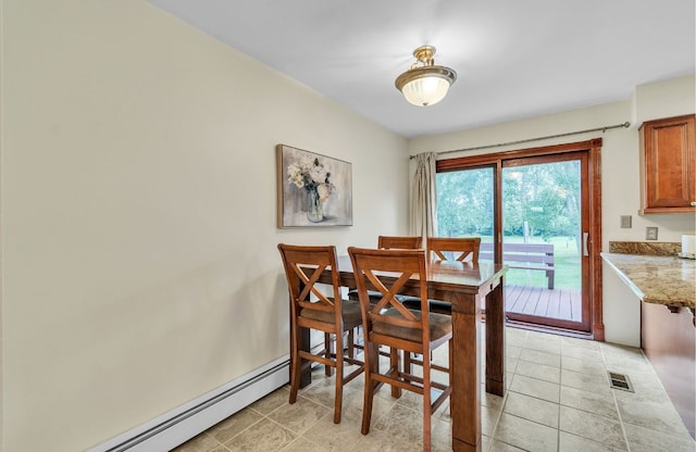 dining area with a baseboard heating unit