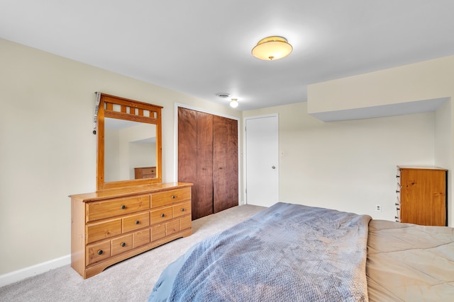 carpeted bedroom featuring a closet