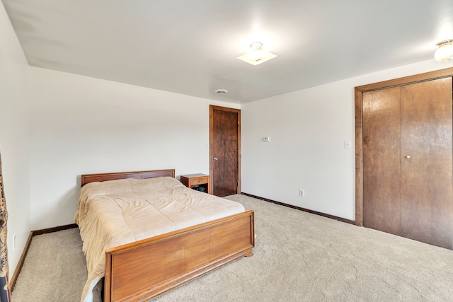 carpeted bedroom featuring a closet