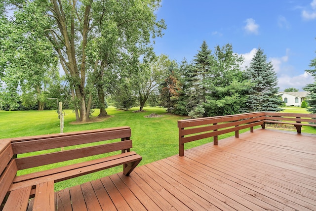 wooden deck with a lawn