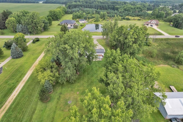 birds eye view of property with a water view and a rural view