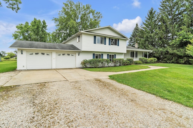 view of front property with a front lawn and a garage