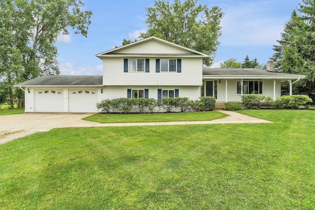 split level home featuring a porch, a garage, and a front yard