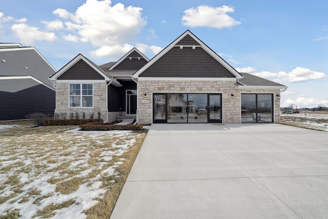 view of front of house featuring concrete driveway and an attached garage