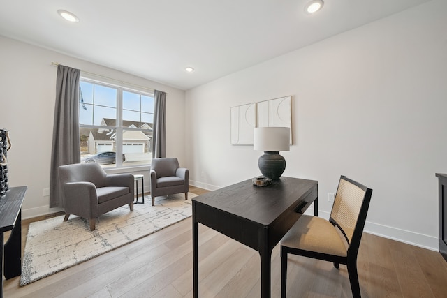 home office with baseboards, wood finished floors, and recessed lighting