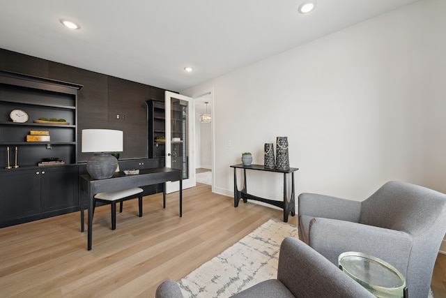 office space with light wood finished floors, baseboards, and recessed lighting