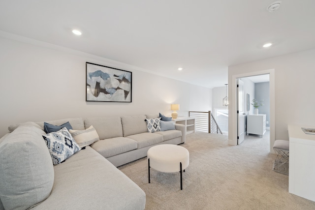 living room featuring recessed lighting and light colored carpet