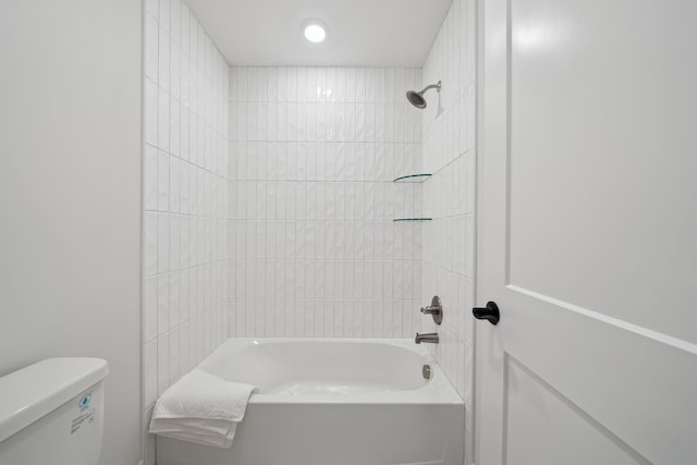 bathroom featuring shower / tub combination and toilet