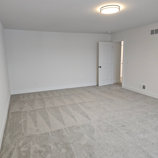 unfurnished room with light colored carpet