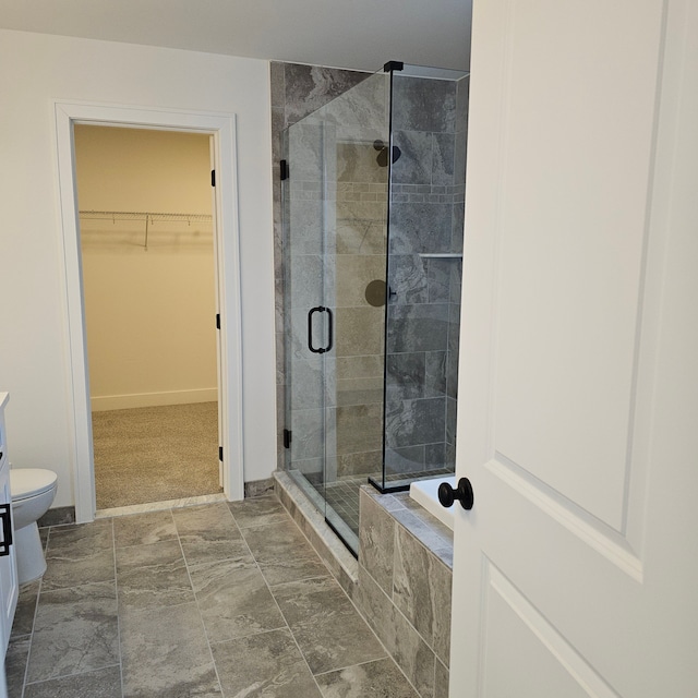 bathroom featuring toilet and separate shower and tub