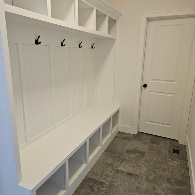 18240 Stallmann Dr, Macomb, MI 48042 - mudroom with dark stone finish floors and baseboards