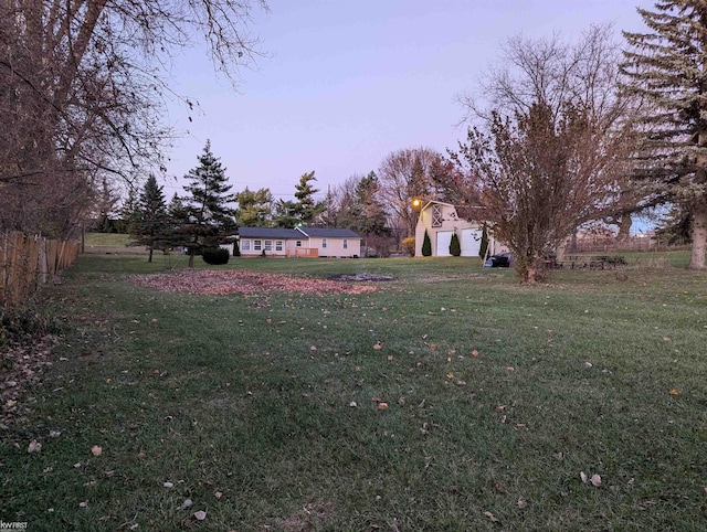 yard at dusk with a garage