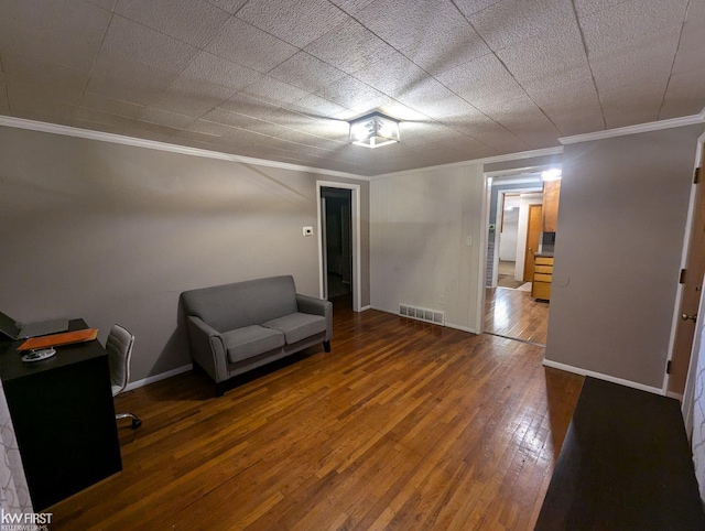 unfurnished room with dark hardwood / wood-style flooring and crown molding