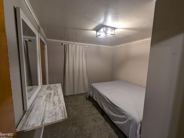 bedroom featuring dark carpet and ornamental molding