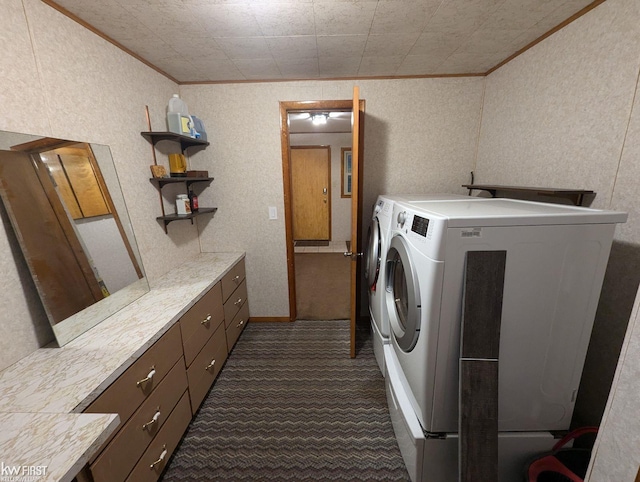 laundry room featuring dark carpet, cabinets, crown molding, and washing machine and clothes dryer