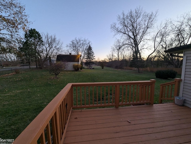 deck at dusk with a yard